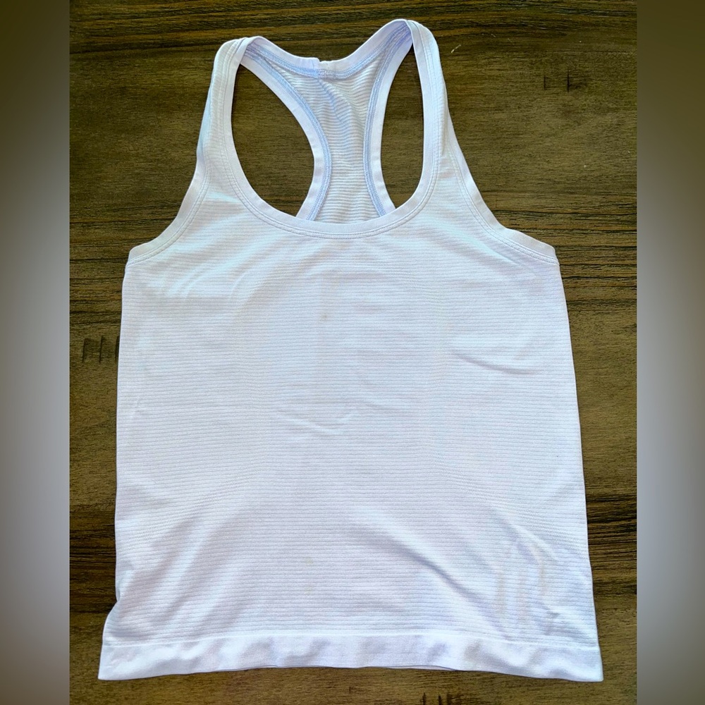 Size 4 Swiftly Tech Racerback Tank Top
2.0
Waist Length